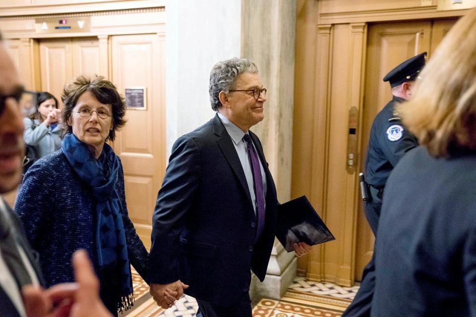 Sen. Al Franken, D-Minn., arrives with his wife Franni Bryson, left, on Capitol Hill in Washington, Thursday morning, Dec. 7, 2017. (AP Photo/Andrew Harnik)