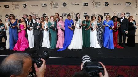 The cast of "Orange is the New Black" holds their awards for Outstanding Performance by an Ensemble in a Comedy Series during the 22nd Screen Actors Guild Awards in Los Angeles, California January 30, 2016. REUTERS/Mike Blake