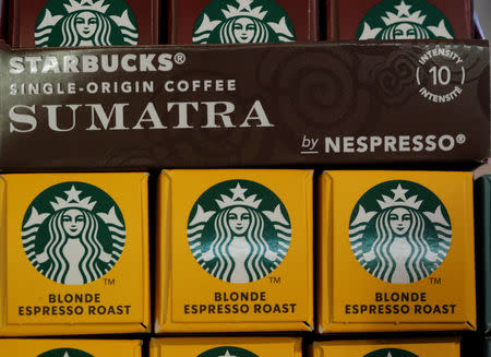 Boxes containing Starbucks labeled single-serve coffee capsules for Nespresso coffee makers are displayed after a news conference to announce that Nestle will sell Starbucks-branded coffee at grocery stores in Europe, Asia and Latin America at the company's headquarters in Vevey, Switzerland February 13, 2019. REUTERS/Arnd Wiegmann