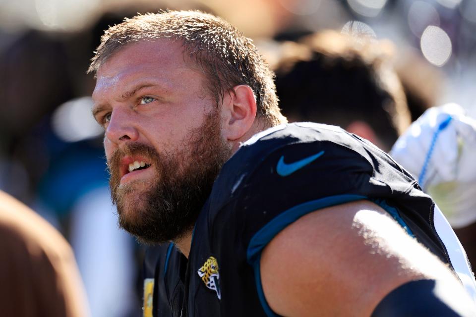 Jacksonville Jaguars guard Brandon Scherff (68) looks on from the sideline during the second quarter an NFL football matchup Sunday, Nov. 19, 2023 at EverBank Stadium in Jacksonville, Fla. The Jacksonville Jaguars defeated the Tennessee Titans 34-14. [Corey Perrine/Florida Times-Union]