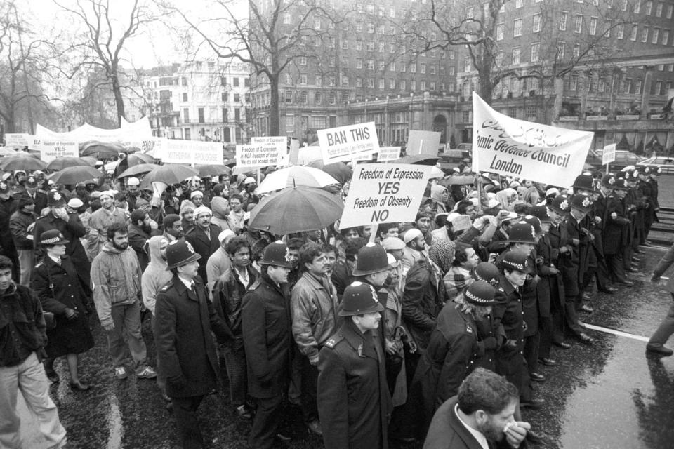 A rally in London’s Park Lane against the publication of Salman Rushdie’s controversial book The Satanic Verses in 1989 (PA) (PA Archive)