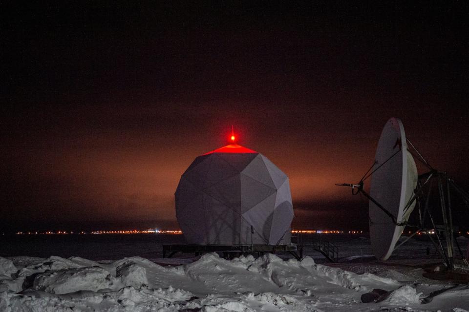 A radar dome is illuminated at the North American Aerospace Defense Command (NORAD) Point Barrow Long Range Radar Site, north of the northernmost town in the United States in Utqiagvik, Alaska, on February 3, 2023.