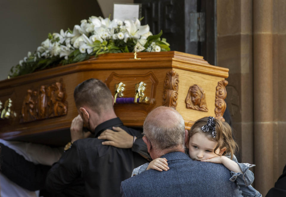 The daughter of Samantha Willis (nee Curran), Lilyanna, is carried into St Columb's Church, Londonderry, behind the coffin for the funeral for the mother-of-four from Strathfoyle who died with Covid-19 shortly after giving birth on Friday. Picture date: Monday August 23, 2021.