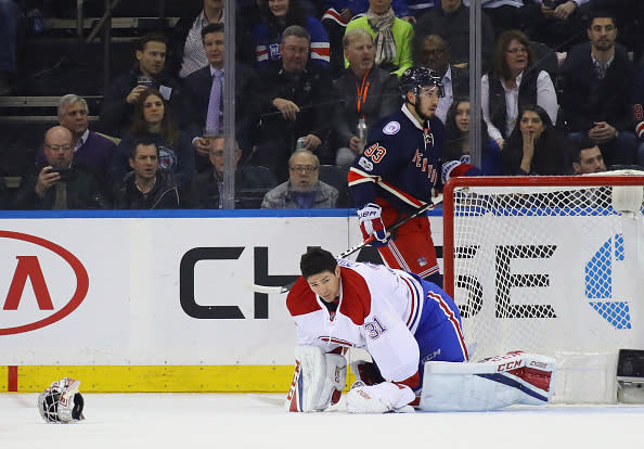 NEW YORK, NY - FEBRUARY 21: Carey Price #31 of the Montreal Canadiens pauses as his mask is knocked off during the first period against the New York Rangers at Madison Square Garden on February 21, 2017 in New York City. (Photo by Bruce Bennett/Getty Images)