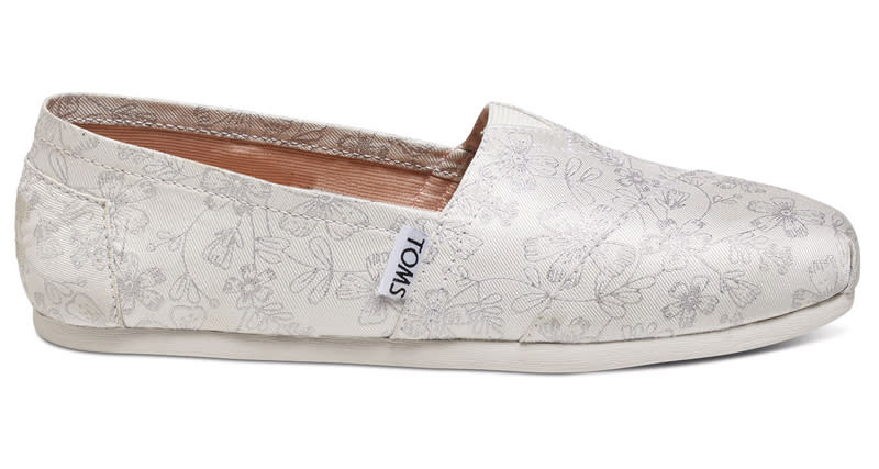 <p>This popular style recently came back in stock. Brides love the ivory floral deisgn, molded insole, and comfortable fit of these TOMS.</p> <p><strong>To buy</strong>: $59; <a rel="nofollow noopener" href="http://click.linksynergy.com/fs-bin/click?id=93xLBvPhAeE&subid=0&offerid=417191.1&type=10&tmpid=12816&RD_PARM1=http%3A%2F%2Fwww.toms.com%2Ffeatured-shops%2Fivory-silver-floral-jacquard-womens-classics&u1=SYNinstyleRCcomfortweddingshoes" target="_blank" data-ylk="slk:toms.com;elm:context_link;itc:0;sec:content-canvas" class="link ">toms.com</a></p>