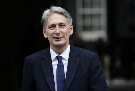 Philip Hammond leaves 10 Downing Street as Britain's Prime Minister David Cameron begins to appoint his cabinet after securing a majority goverment, in central London, May 8, 2015. REUTERS/Kevin Coombs