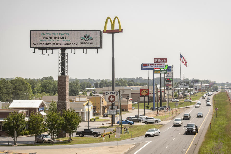 A billboard from a group in support of public libraries is seen near Benton, Ark., on May 25, 2023.  (Brandon Dill for NBC News)