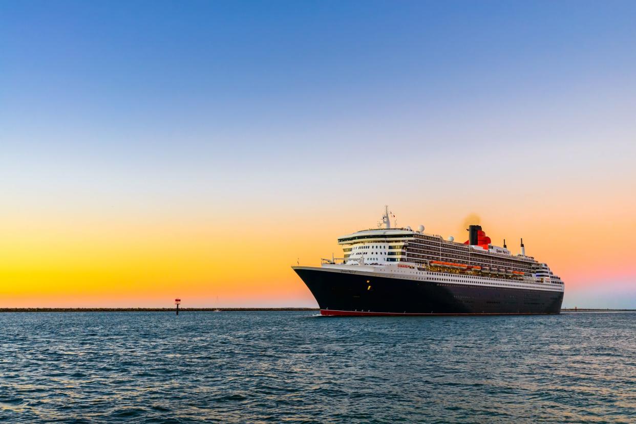 Adelaide, Australia - February 16, 2018: Cunard Line flagship Queen Mary 2 with people on board leaving Outer Harbour for cruise to Melbourne