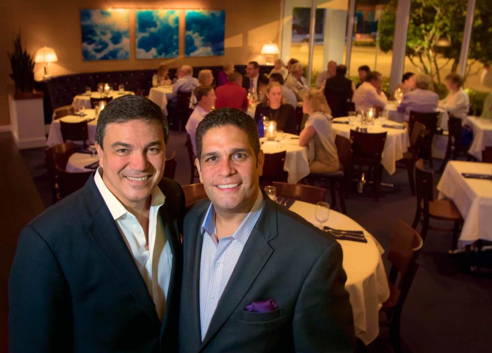 Ozzie Medeiros, at left, and Eddie Schmidt own and operate Table 26 in West Palm Beach. The chic, nautical-themed restaurant draws in a steady Palm Beach crowd.