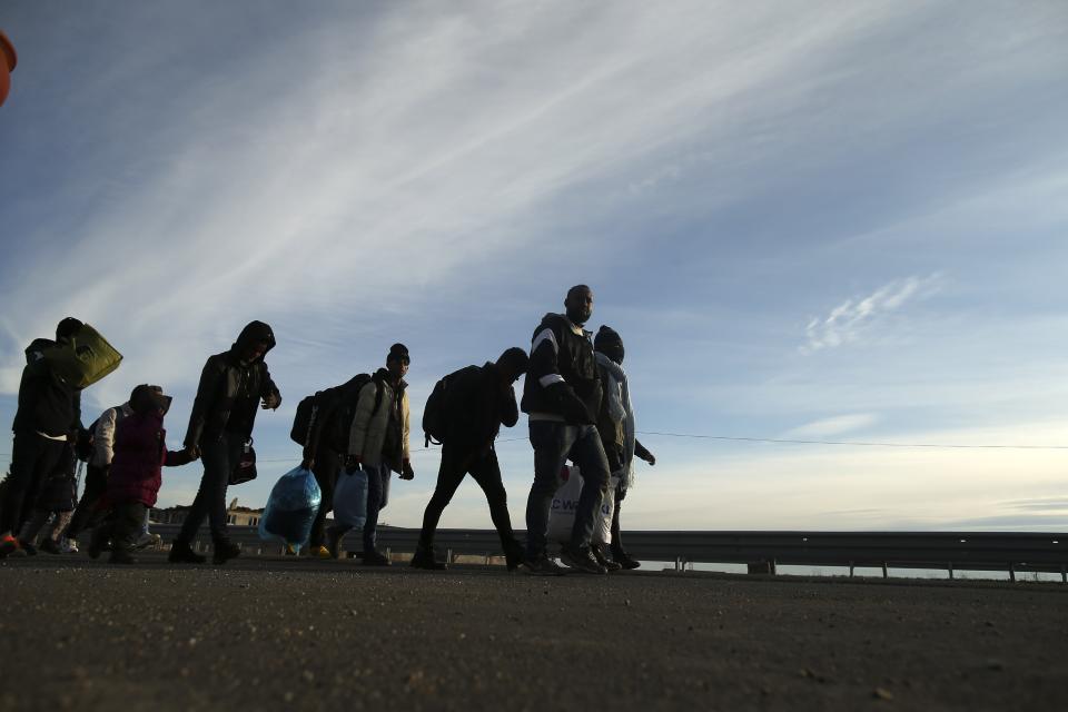 Migrants walk in Edirne, near the Turkish-Greek border on Friday, March 6, 2020. Thousands of refugees and other asylum-seekers have tried to enter Greece from the land and sea in the week since Turkey declared its previously guarded gateways to Europe open. (AP Photo/Emrah Gurel)