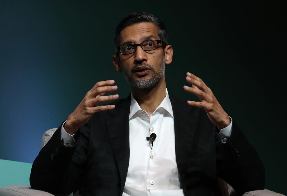 Google has laid off an unspecified number of workers and moved some positions overseas. Google CEO Sundar Pichai is seen above. Getty Images