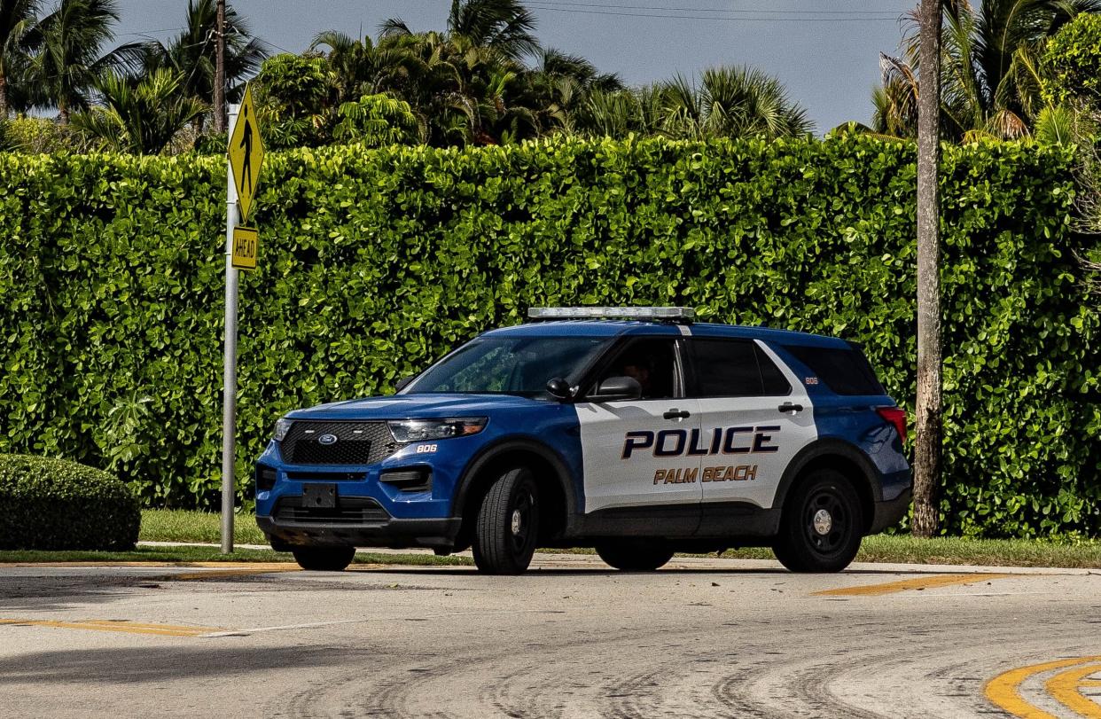 A Palm Beach police vehicle is parked in the traffic circle on the west side of Mar-a-Lago Wednesday morning August 10, 2022.