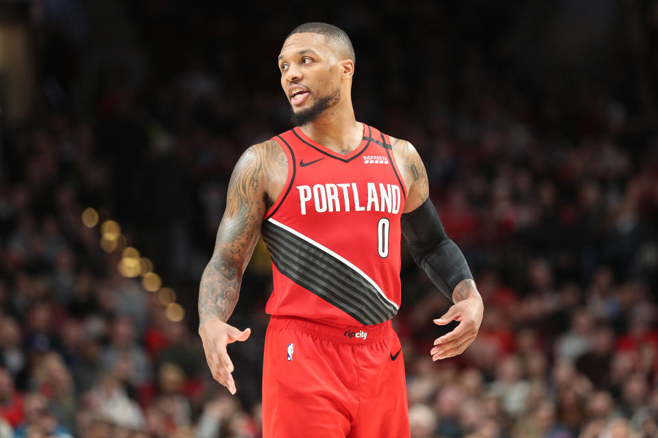 In an emotional night at Staples Center, Damian Lillard nearly posted a triple-double to lead the Trail Blazers past the Lakers. (Abbie Parr/Getty Images)