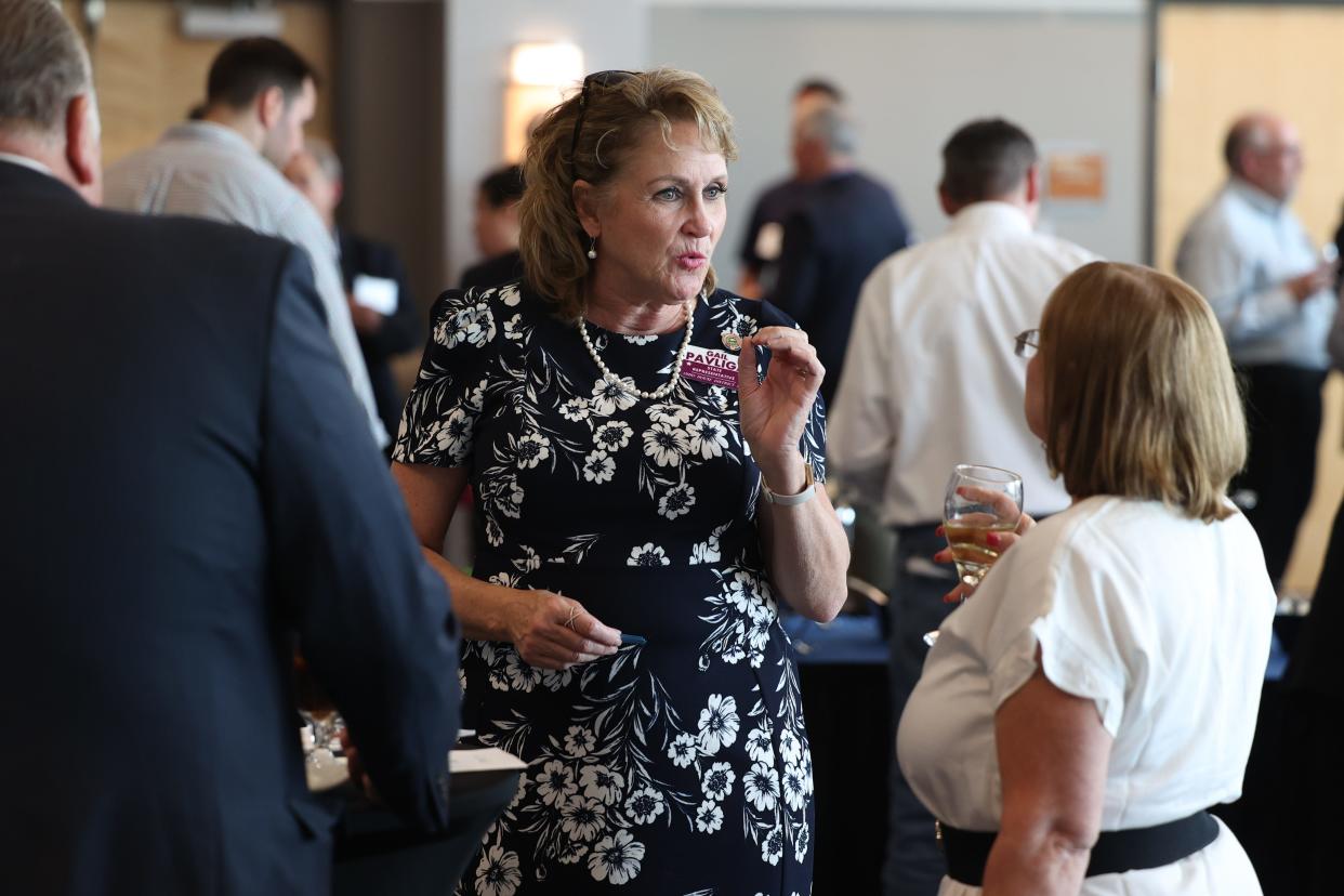 State Representative Gail Pavliga mingles with guests before the Portage Development Board’s “Locate. Stay. Grow.” Awards event at NEOMED’s The NEW Center in Rootstown Thursday, May 19.