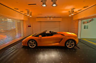 A Lamborghini Gallardo arrives at an ensuite elevated garage at the Hamilton Scotts luxury residence in Singapore (Yahoo! photo)