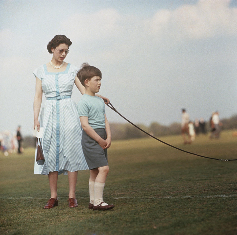 Queen Elizabeth with her eldest son at Windsor Great Park, during a polo match in 1956. (Photo by Hulton Archive/Getty Images)