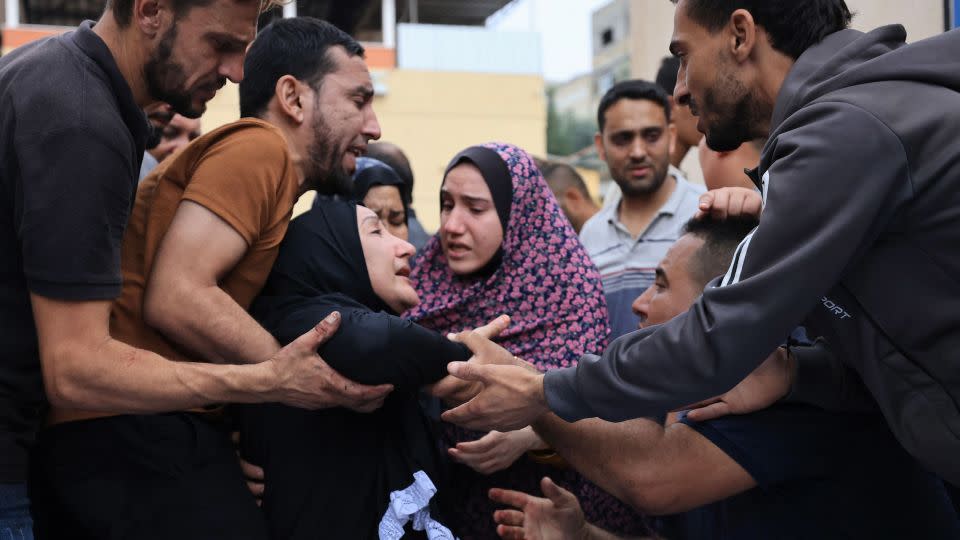 Palestinians mourn the death of their relatives following an Israeli airstrike on the refugee camp of Jabalia in the Gaza Strip on October 9, 2023. - Mahmud Hams/AFP via Getty Images