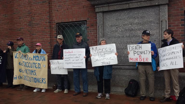 Protesters against the death penalty gather in front of the John Joseph Moakley United States Courthouse April 21, 2015 in Boston, Massachusetts