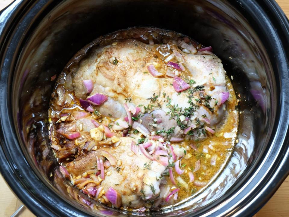 pulled pork cooking in a crock pot