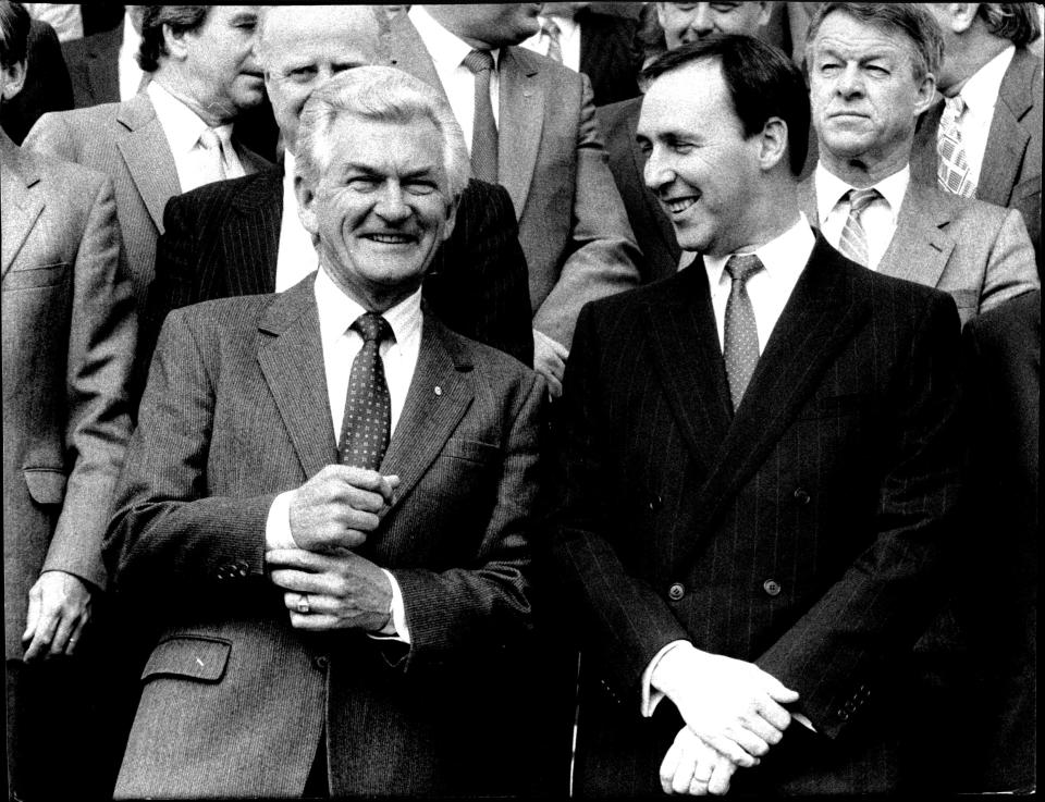 Paul Keating and Bob Hawke and Labor Caucus on the front steps of Parliament on 1987 budget day.