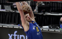 Denver Nuggets center Nikola Jokic dunks during the first half of the team's NBA basketball game against the Portland Trail Blazers in Portland, Ore., Wednesday, April 21, 2021. (AP Photo/Steve Dykes)