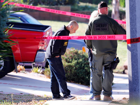 Police and FBI officers wait outside the home of the suspect in a shooting incident at a Thousand Oaks bar, in Newbury Park, California, U.S. November 8, 2018. REUTERS/Mike Blake