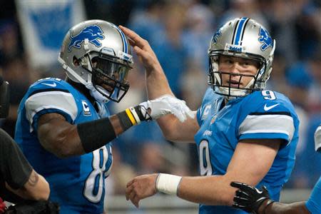 Detroit Lions wide receiver Calvin Johnson (81) celebrates his touchdown with quarterback Matthew Stafford (9) during the third quarter against the Green Bay Packers during a NFL football game on Thanksgiving at Ford Field. Mandatory Credit: Tim Fuller-USA TODAY Sports