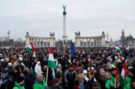 People gather to take part in a protest against a proposed new labor law, billed as the "slave law", at the Heroes' square in Budapest, Hungary, December 16, 2018. REUTERS/Bernadett Szabo