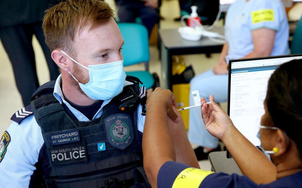 New South Wales Police officer Lachlan Pritchard receives the Pfizer vaccine - News Corp Australia Pool