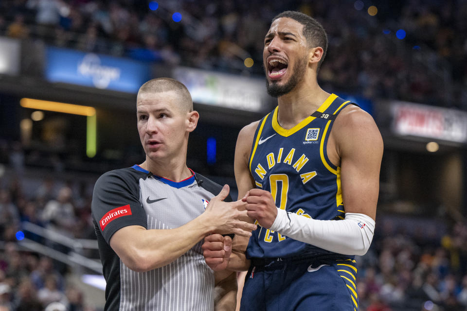 Indiana Pacers guard Tyrese Haliburton (0) reacts after drawing a technical foul while scoring during the first half of an NBA basketball game against the Detroit Pistons in Indianapolis, Thursday, Feb. 22, 2024. (AP Photo/Doug McSchooler)