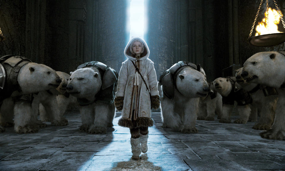 a girl standing in front of a bunch of polar bears