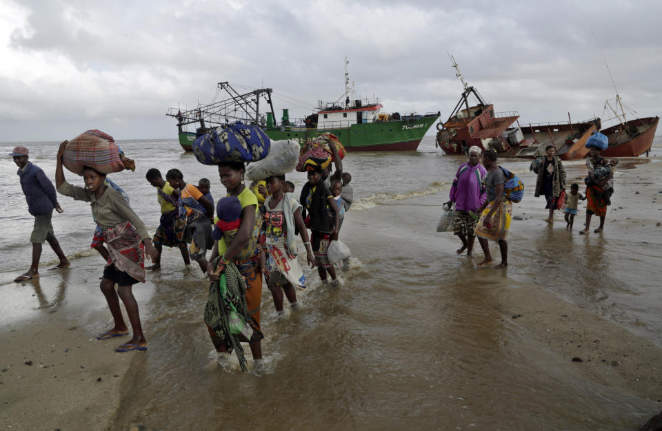FILE — Displaced families arrive after being rescued by boat from a flooded area of Buzi district, 200 kilometers (120 miles) outside Beira, Mozambique, Saturday, March 23, 2019. Much of the world takes daily weather forecasts for granted. But most of Africa's 1.3 billion people live with little advance knowledge of what's to come. That can be deadly, with damage running in the billions of dollars. The first Africa Climate Summit opens this week in Kenya to highlight the continent that will suffer the most from climate change while contributing to it the least. At the heart of every issue on the agenda, from energy to agriculture, is the lack of data collection that drives decisions as basic as when to plant and when to flee. (AP Photo/Tsvangirayi Mukwazhi, File)