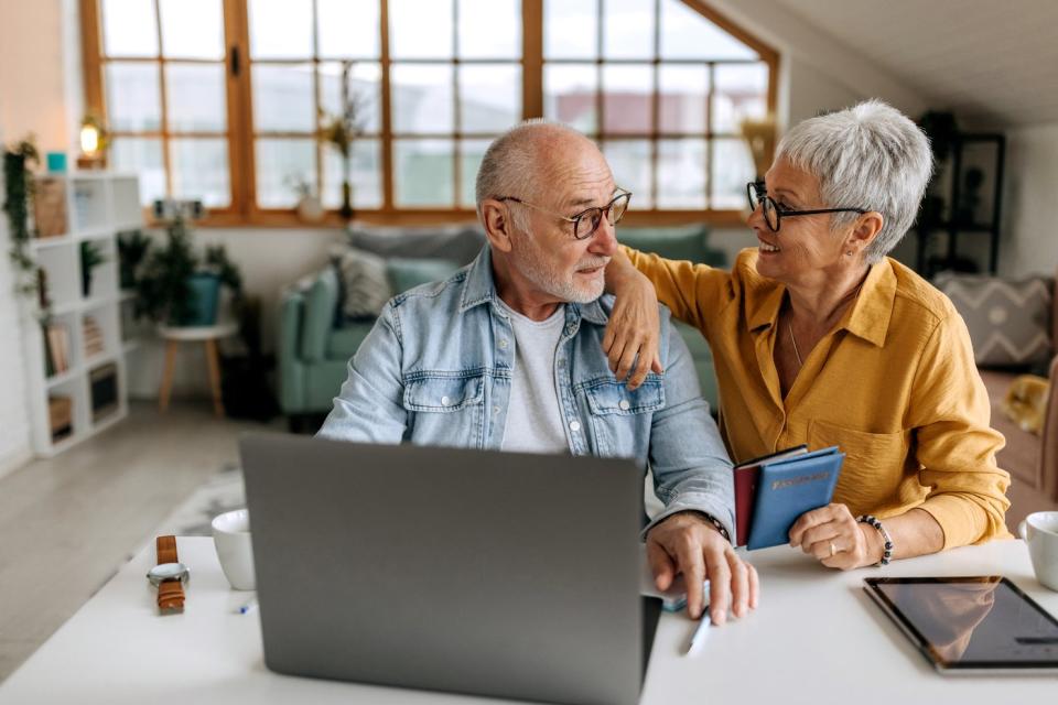 A couple at a laptop.