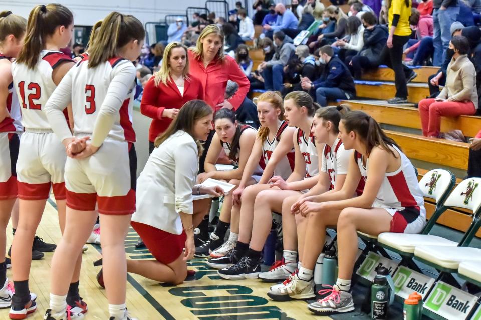 CVU head coach Ute Otley talks strategy with her team during the 2022 Division I girls basketball semifinals at Patrick Gym.