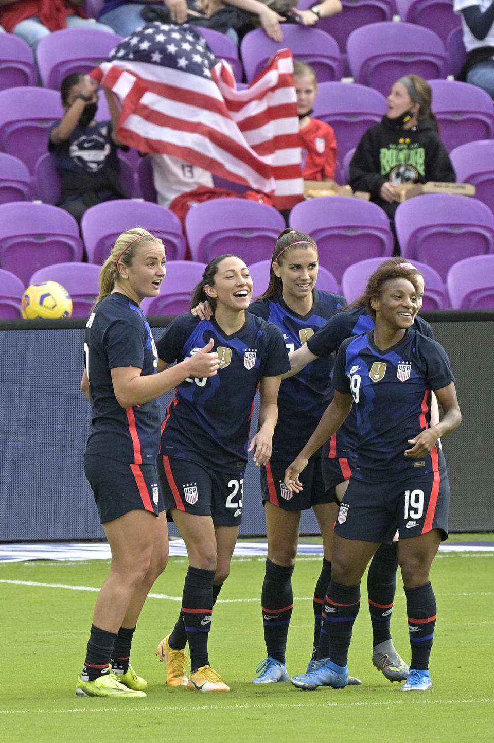 The United States forward Christen Press, second from left, is congratulated by teammates Lindsey Horan, left, Alex Morgan, and Crystal Dunn (19) after Press scored a goal during the first half of a SheBelieves Cup women's soccer match against Brazil, Sunday, Feb. 21, 2021, in Orlando, Fla. (AP Photo/Phelan M. Ebenhack)