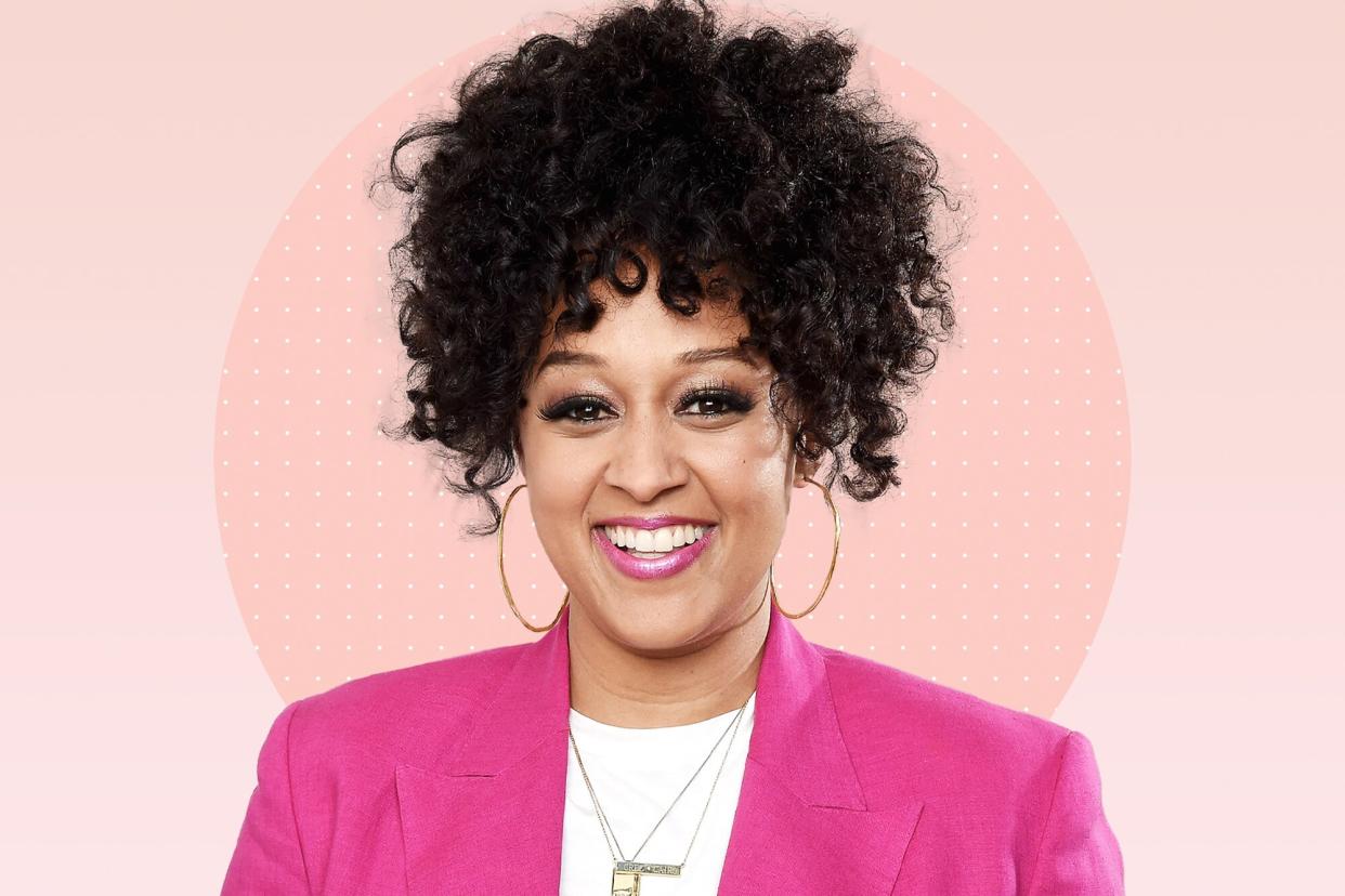 a portrait of Tia Mowry on a designed background