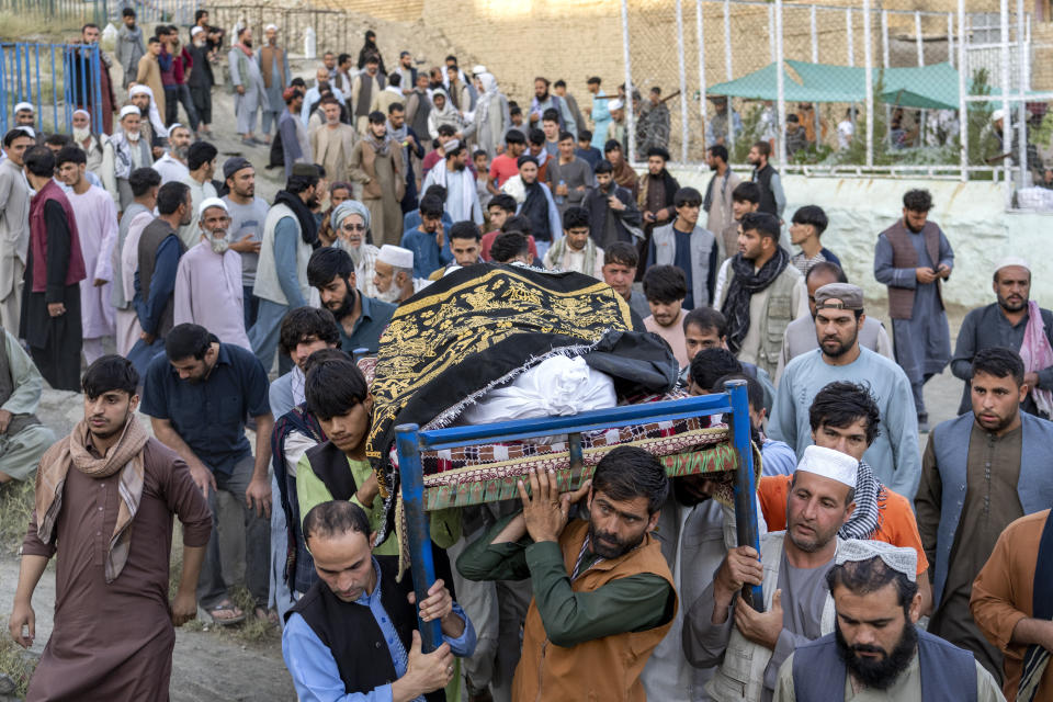 FILE - Mourners carry the body of a victim of an explosion in a restaurant in Kabul, Afghanistan, Wednesday, Sept. 21, 2022. The Taliban say at least three people have been killed and 13 others wounded in an explosion in the Afghan capital. AP Photo/Ebrahim Noroozi, File)