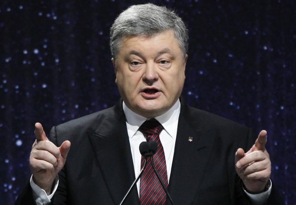 Ukrainian President Petro Poroshenko speaks at the ceremony commemorating the fallen Heroes of the "Heavenly Hundred" in Kiev, Ukraine, Thursday, Feb. 16, 2017. The "Heavenly Hundred" is what Ukrainians in Kiev call those who died during months of anti-government protests in 2013 and 2014. (AP Photo/Sergei Chuzavkov)