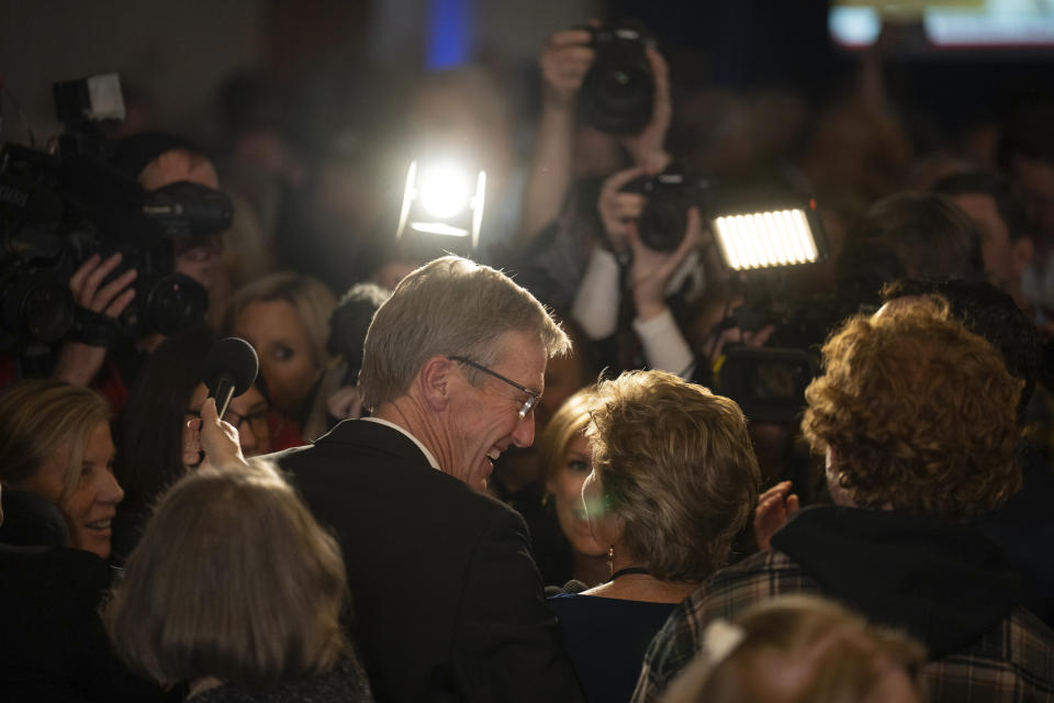 Republican gubernatorial candidate Scott Jensen, with his wife, Mary, stand in front of supporters and the media in the ballroom late Tuesday, Nov. 8, 2022, at the Minnesota Republican Party election night headquarters gathering at the Doubletree Hilton in St. Louis Park, Minn. (Jeff Wheeler/Star Tribune via AP)