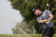 Webb Simpson plays a shot from a bunker on the first hole during the first round of the U.S. Open Golf Championship, Thursday, June 17, 2021, at Torrey Pines Golf Course in San Diego. (AP Photo/Jae C. Hong)