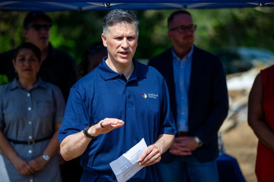 South Bend Heritage Foundation Executive Director Marco Mariani speaks during an open house Friday, May 20, 2022, at Hoose Court Homes in South Bend.