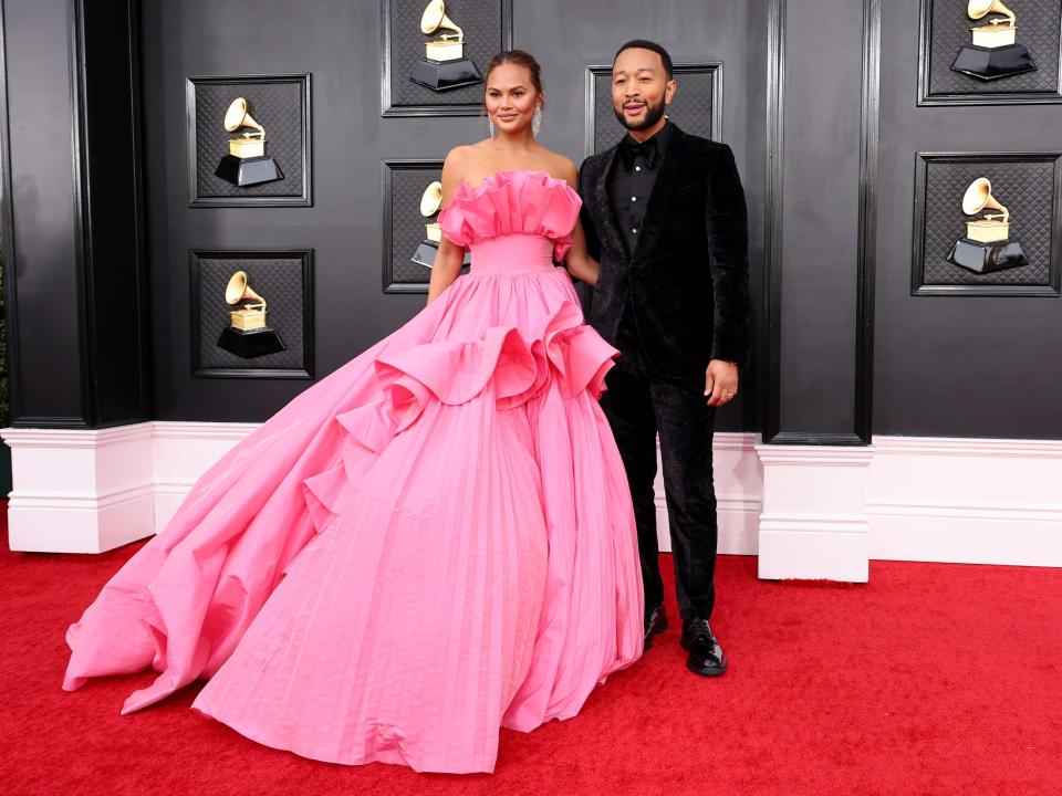 John Legend and Chrissy Teigen attend the 2022 Grammy Awards.