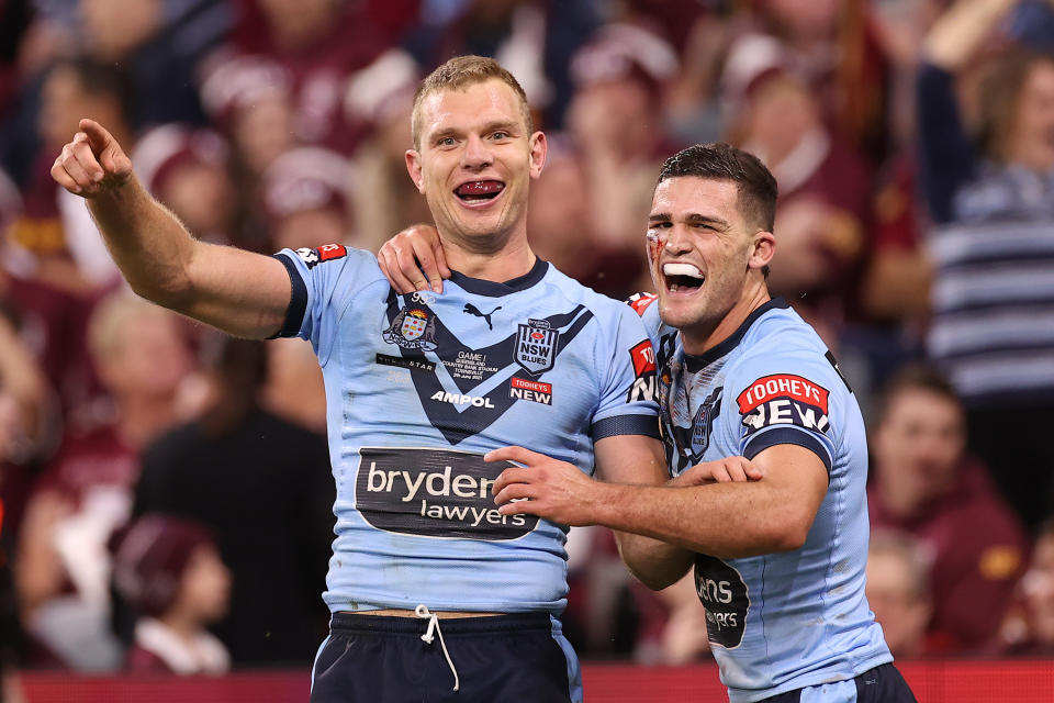 Tom Trbojevic and Nathan Cleary celebrate after scoring a try during game one of the 2021 State of Origin series in Townsville, Australia.