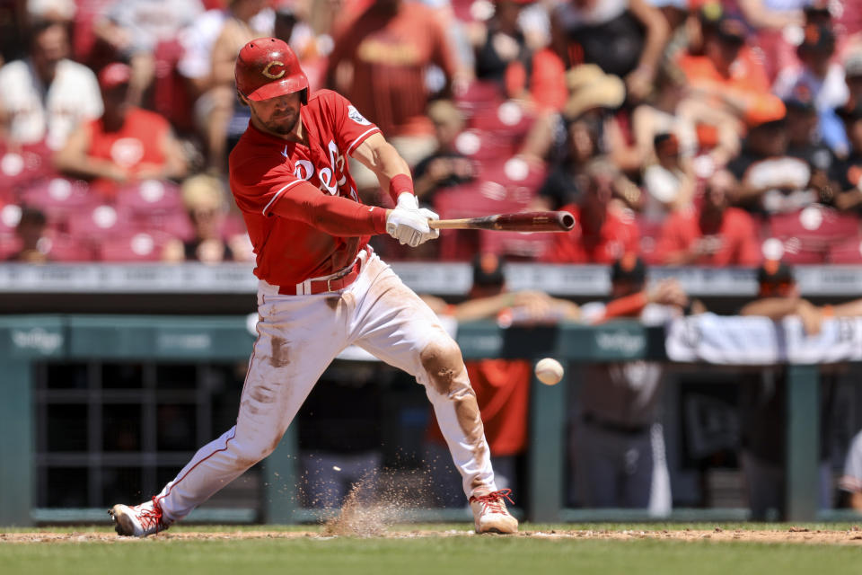 Cincinnati Reds' Kyle Farmer singles during the fourth inning of a baseball game against the San Francisco Giants in Cincinnati, Sunday, May 29, 2022. (AP Photo/Aaron Doster)