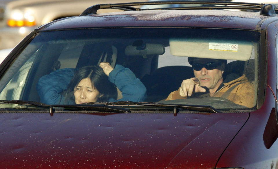 FILE - In this Jan. 11, 2010, file photo, Richard Heene, right, and his wife, Mayumi, arrive at the Laramie County Detention Center in Fort Collins, Colo. The couple convicted of criminal charges in the so-called balloon boy hoax that fascinated the country more than a decade ago was pardoned Wednesday, Dec. 23, 2020, by the governor of Colorado. (AP Photo/ Ed Andrieski, File)