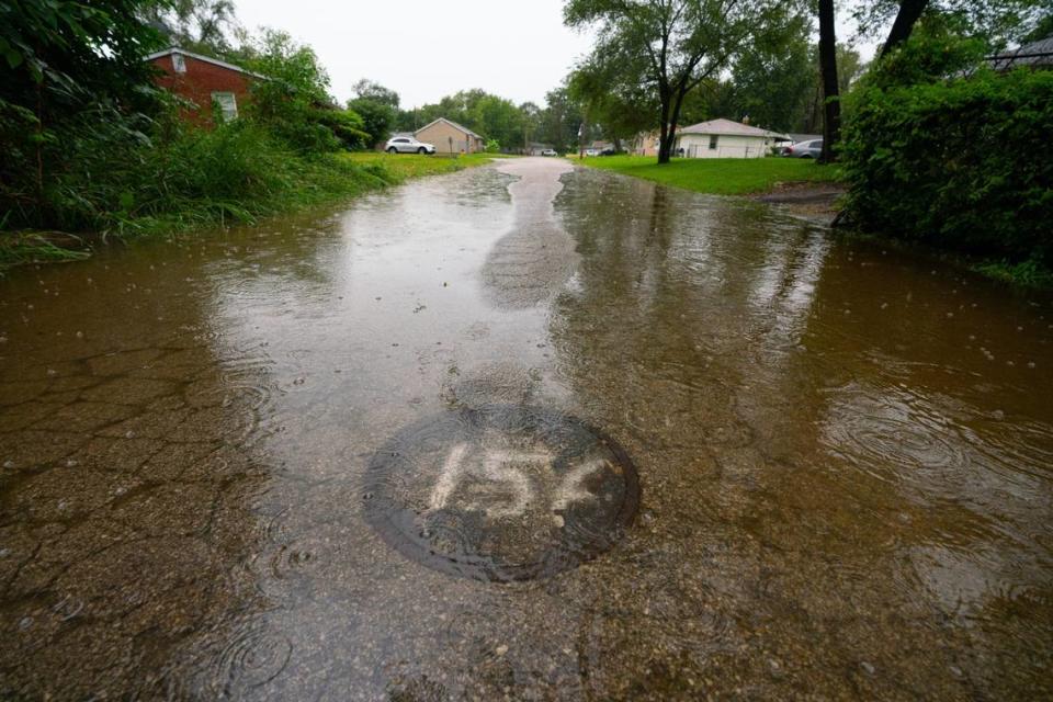 Water pools on the streets in Cahokia Heights during a summer storm. Rain causes anxiety for Cahokia Heights residents because it regularly leads to flooding that makes the sewers overflow. Sewage-contaminated water then enters their homes.