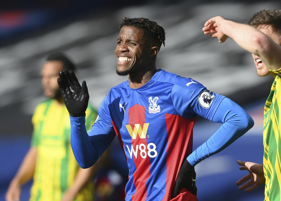 Crystal Palace's Wilfried Zaha reacts during the English Premier League soccer match between Crystal Palace and West Bromwich Albion at Selhurst Park stadium in London, England, Saturday, March 13, 2021.(Mike Hewitt/Pool via AP)