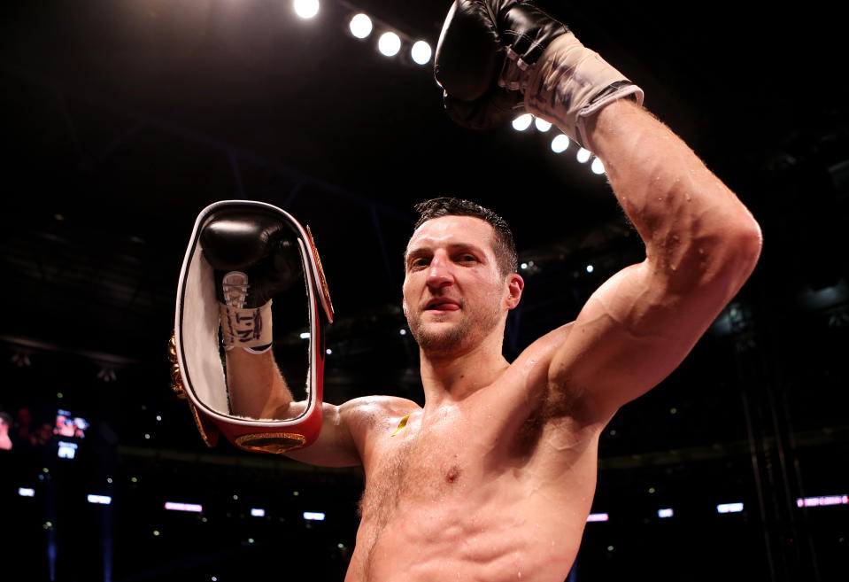 Carl Froch celebrates with his belt after knocking down George Groves during the IBF and WBA World Super Middleweight Title fight at Wembley Stadium, London.   (Photo by Peter Byrne/PA Images via Getty Images)