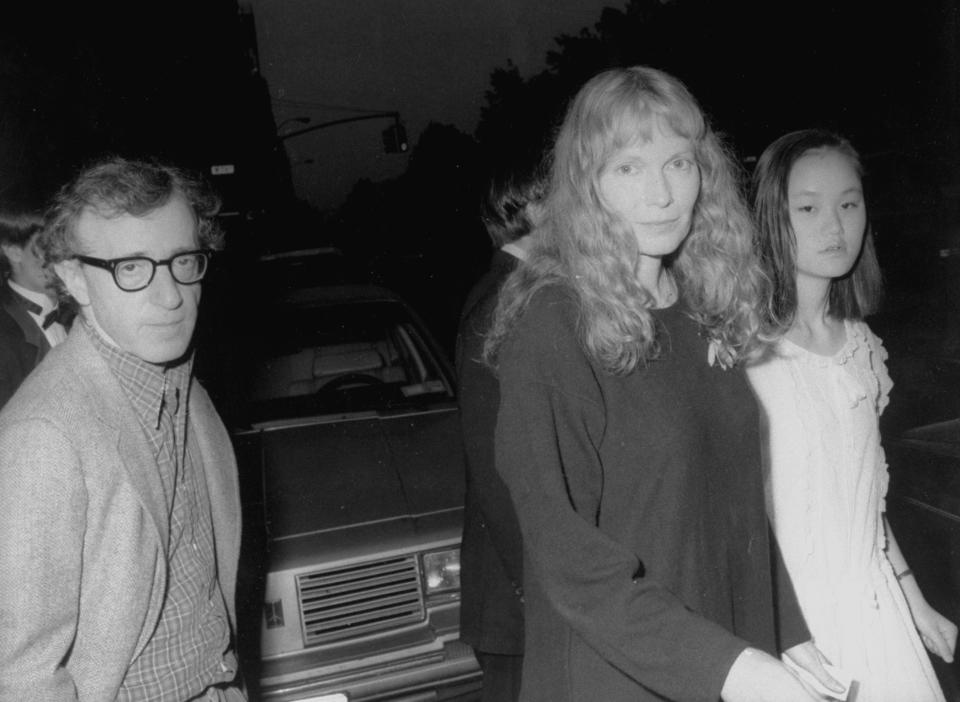 Actors Woody Allen and Mia Farrow w. her adopted daughter Soon-Yi leaving Farrow's apartment to see Liza Minnelli at Carnegie Hall.  (Photo by Time Life Pictures/DMI/The LIFE Picture Collection via Getty Images)