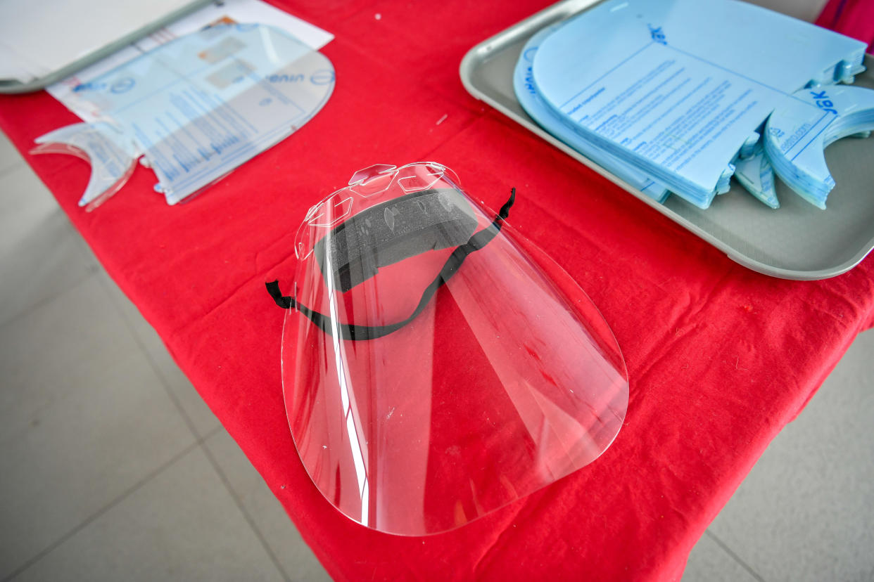 A full face plastic visor made by workers, who usually mint coins at the Royal Mint, Llantrisant, Wales, are now making face visors inside the cafe of the Royal Mint Experience to supply NHS staff to help get PPE to health workers.